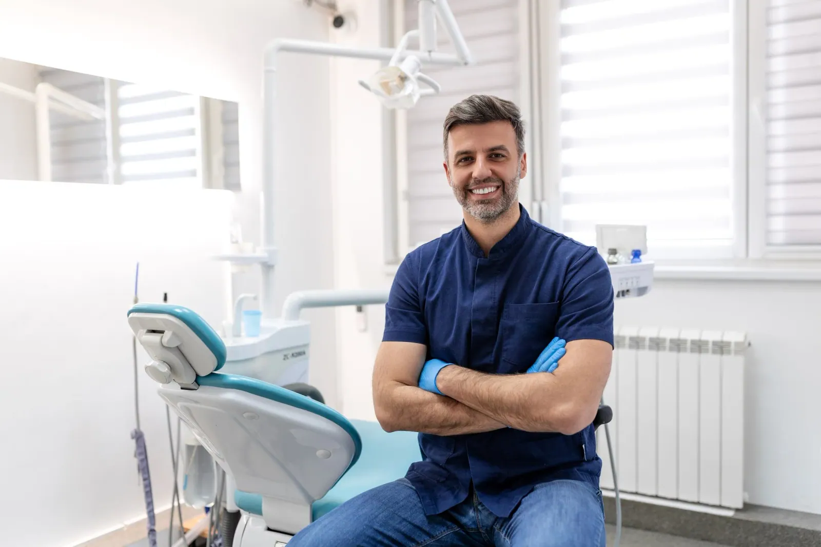 A friendly South African dentist in their practice